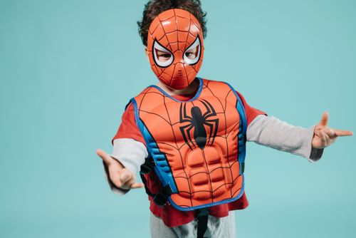 Kid in superhero red costume
