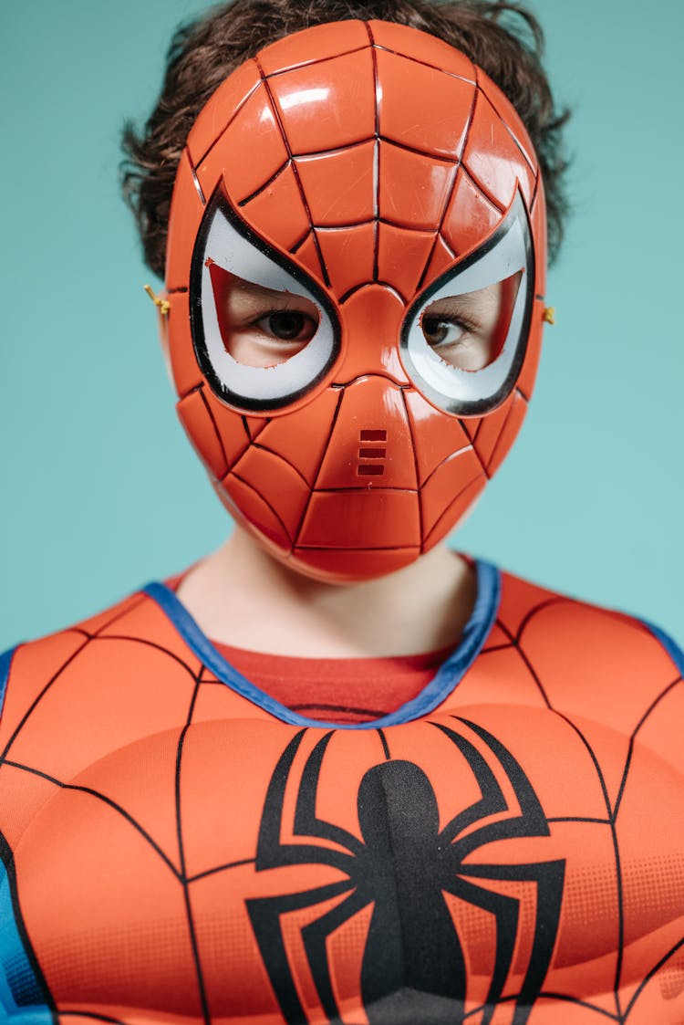 Close Up Photo Of A Boy Wearing Spiderman Costume