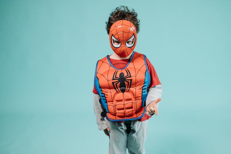 Close-Up Shot Of A Kid In Spiderman Costume