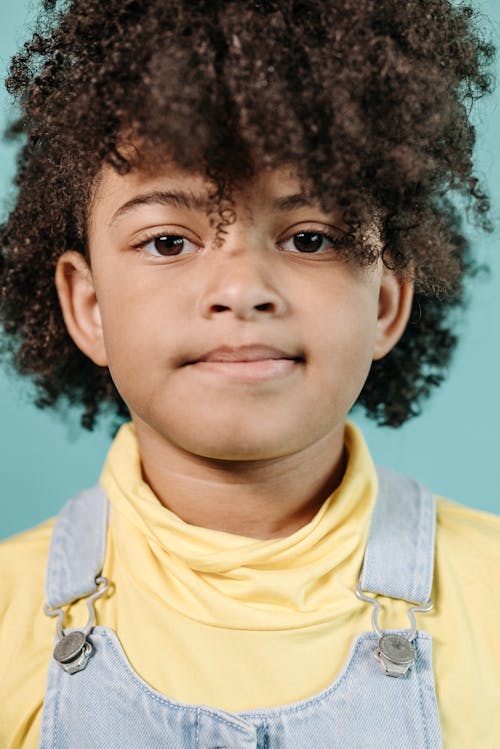 Close-Up Shot of a Curly-Haired Child