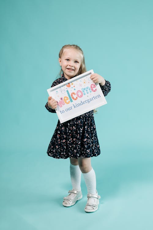 Girl Holding a Placard