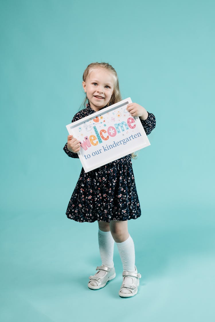 Girl Holding A Placard