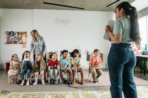 Teachers with Their Pupils in a Classroom