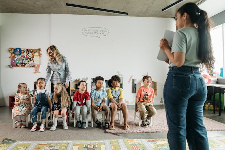 Teachers With Their Pupils In A Classroom