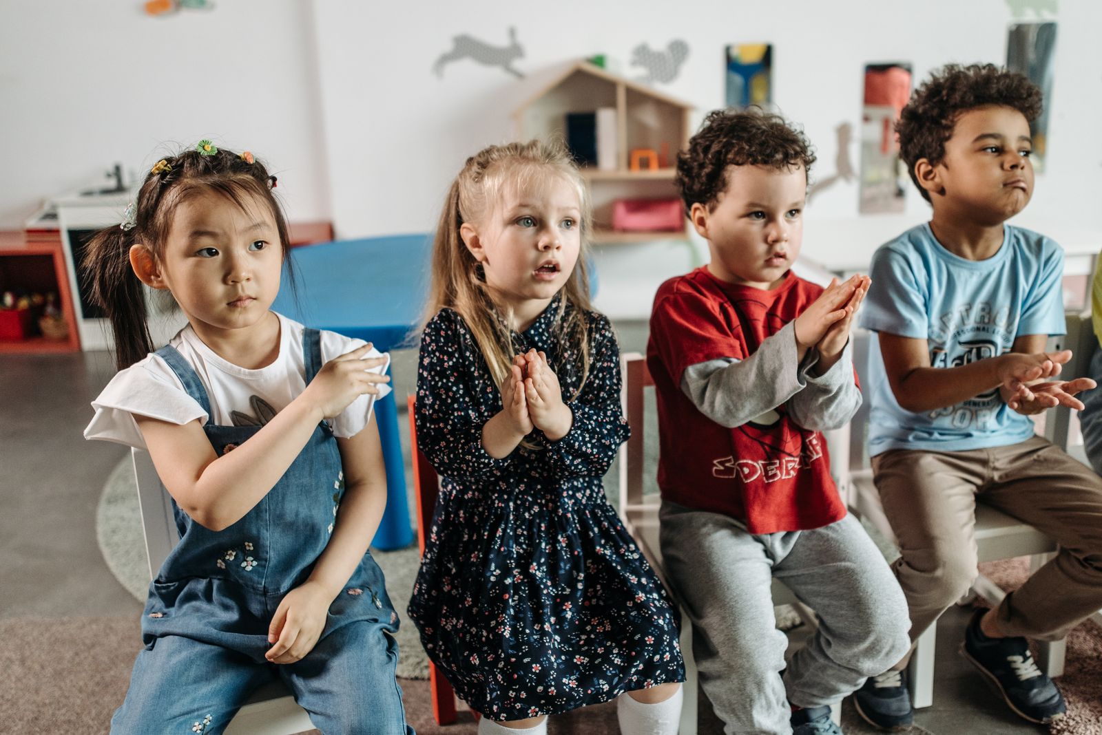 Children sitting together in a reception classroom