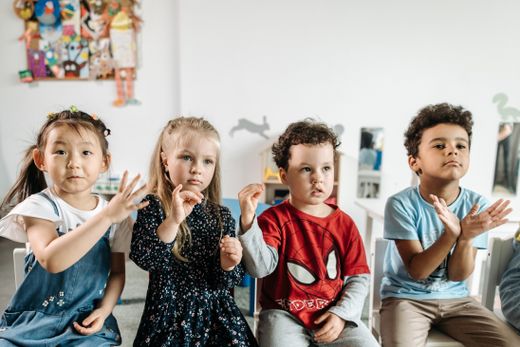 Preschoolers learning together in a bright classroom