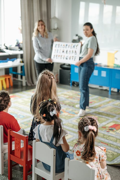 Free Children Sitting in the Room Stock Photo