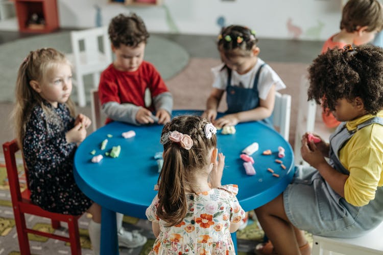 Children Playing Clay Dough In School