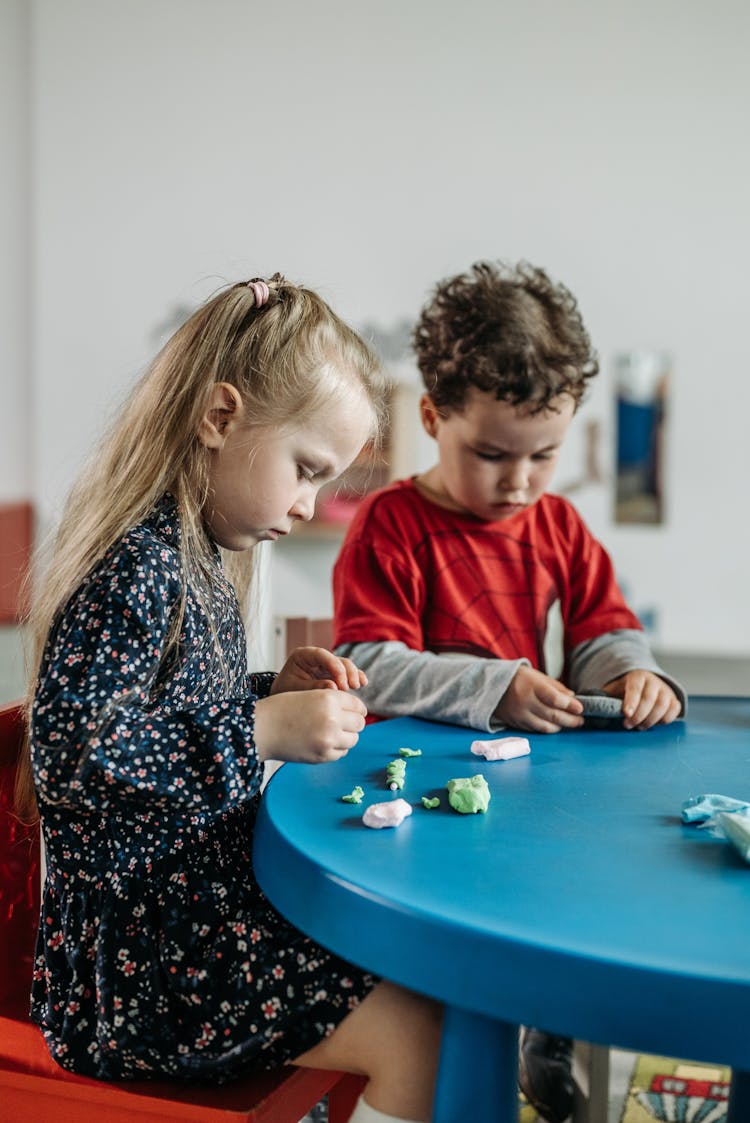 A Boy And Girl Playing Toys 