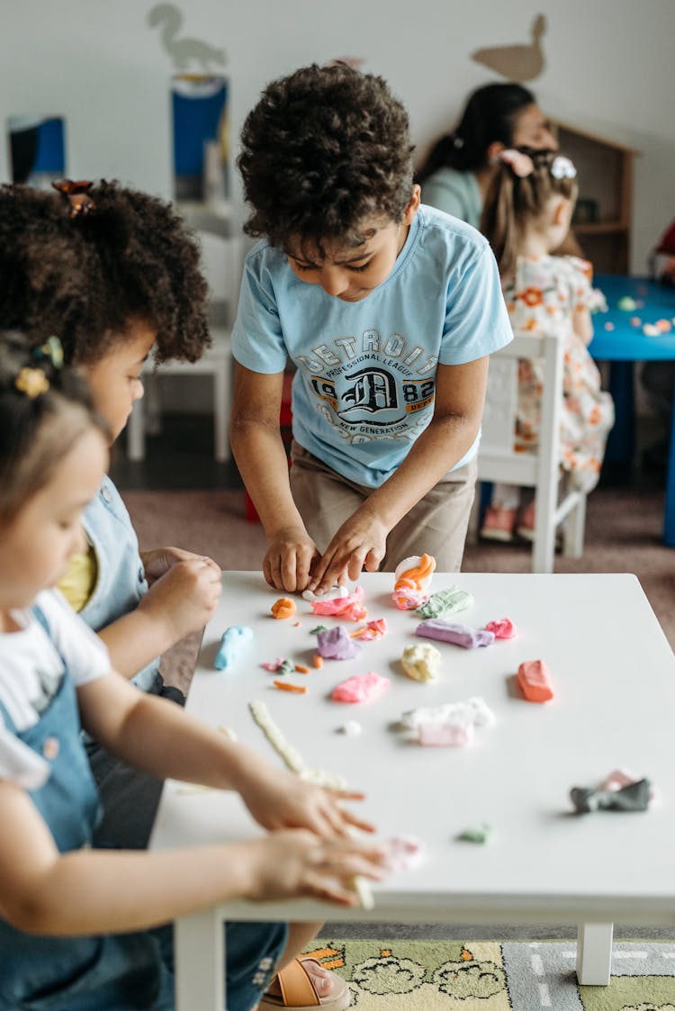 Kids Playing At The Table