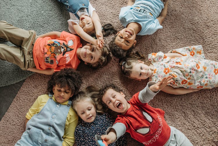 Children Lying On Carpet