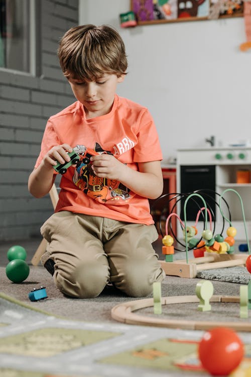 Boy Playing with his Toys