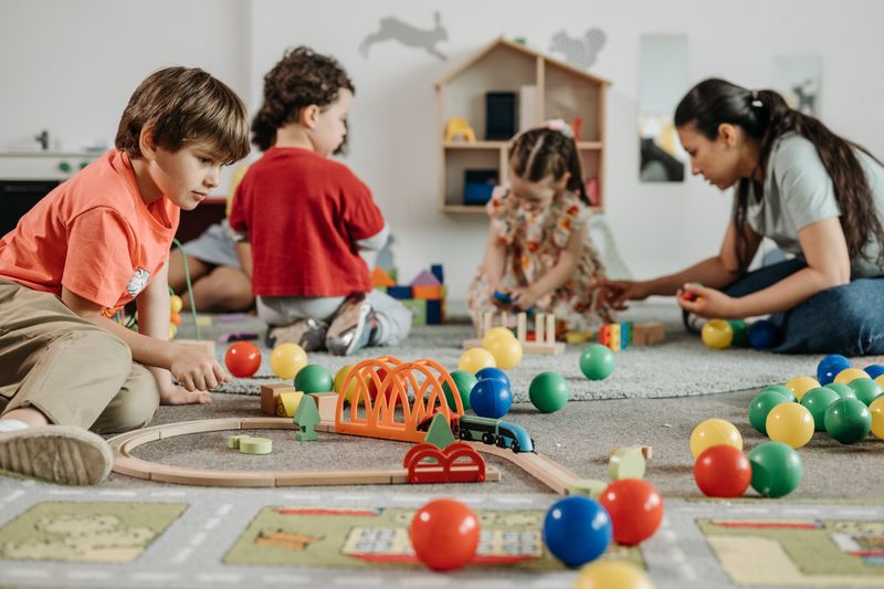 Kids playing with colorful toys in a kindergarten setting, fostering creativity and teamwork.