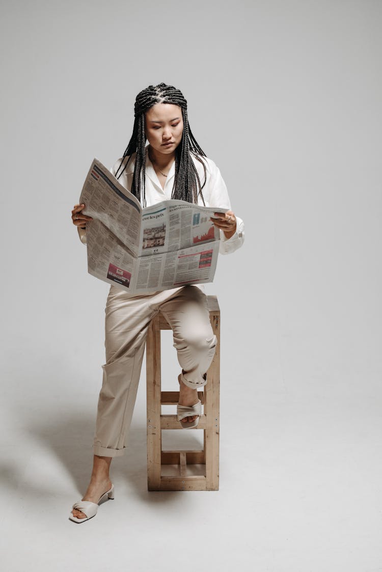 A Woman Reading Newspaper