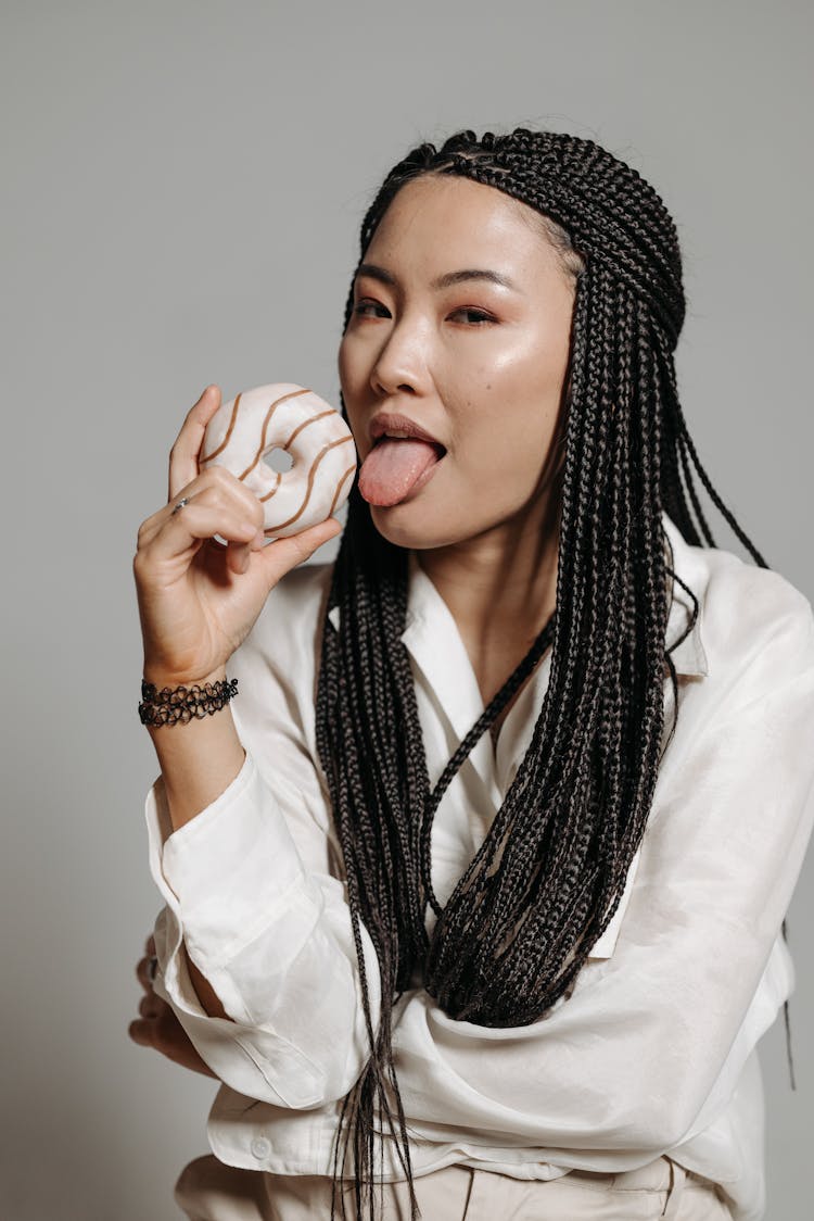 Woman Holding A Donut