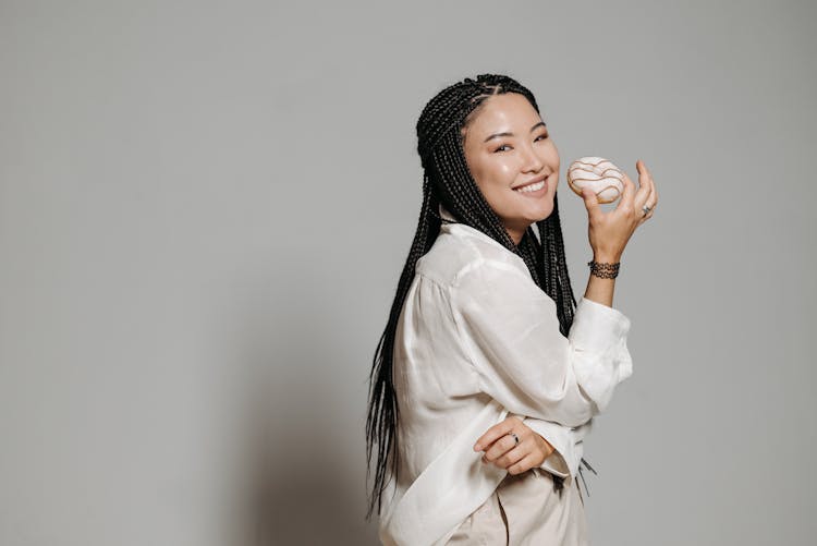 Happy Woman Holding A Donut