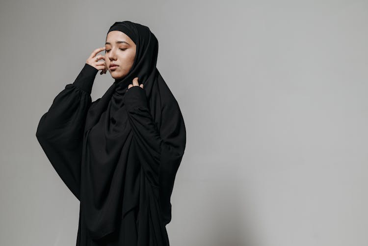 A Pretty Woman In Black Hijab And Abaya