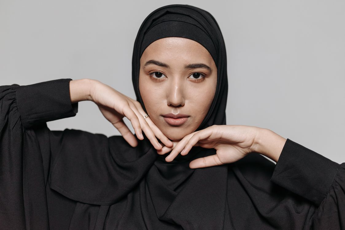 Woman in Black Hijab Touching Her Face · Free Stock Photo