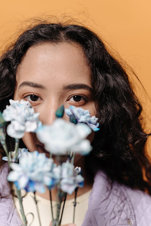 Woman With Blue Flowers over Her Face