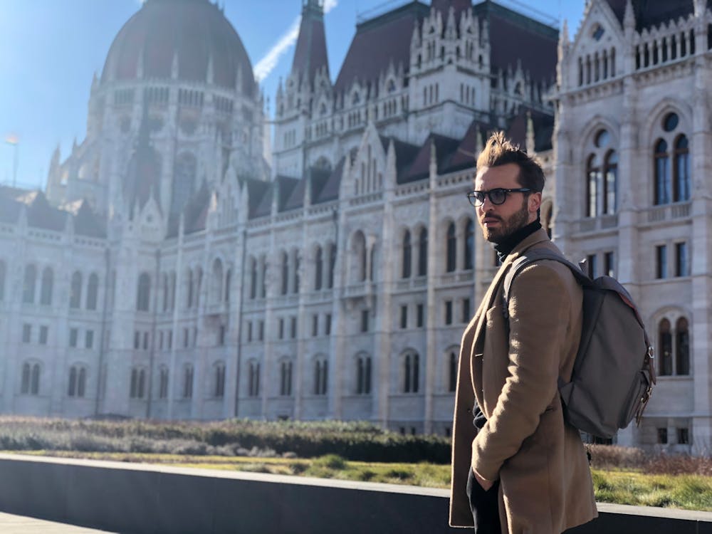 Man Wearing Brown Coat