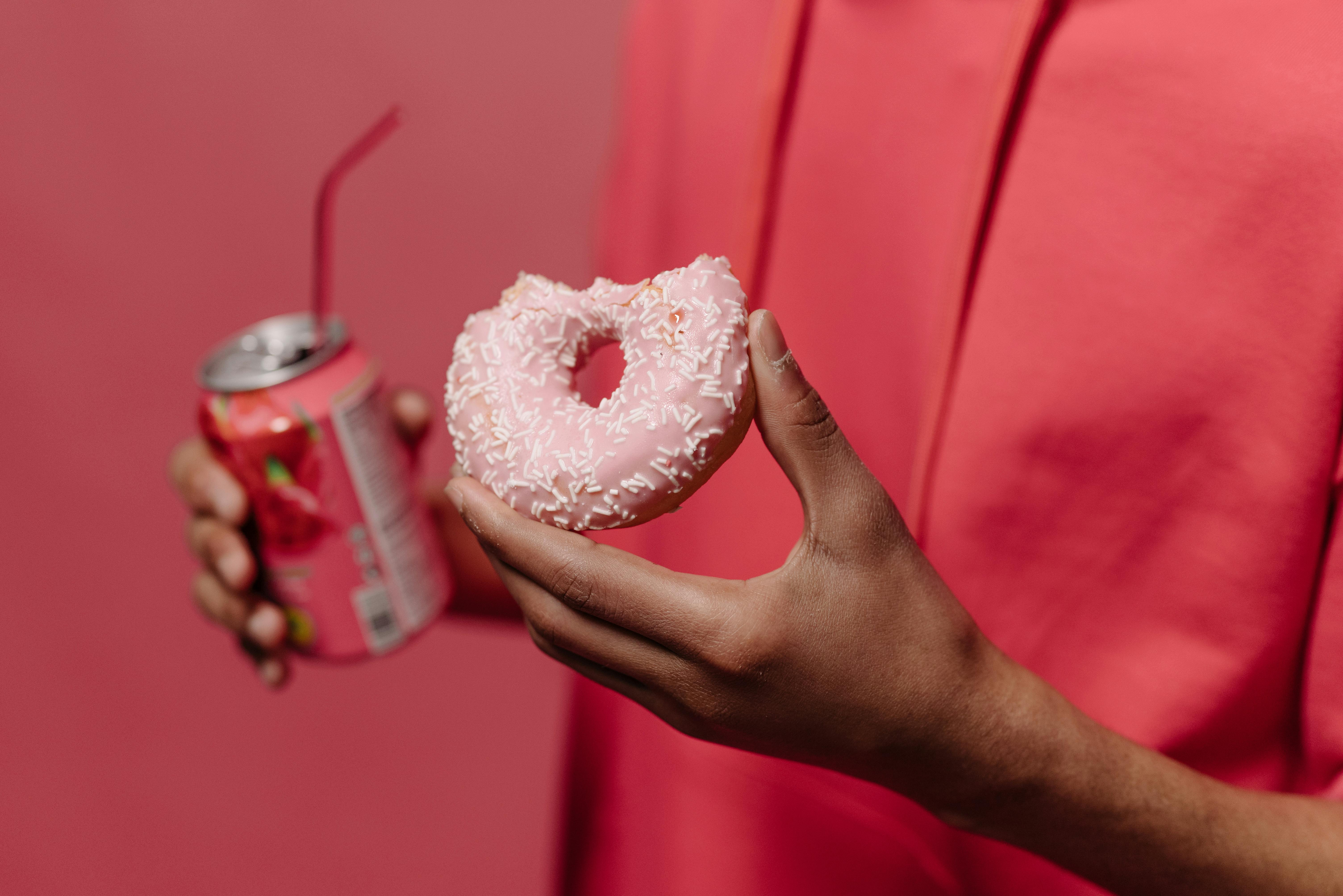 person holding doughnut