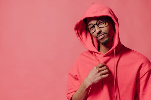 Man in Red Hoodie Wearing Black Framed Eyeglasses