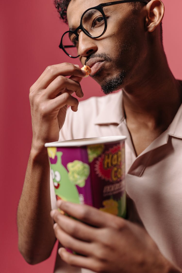 Man In White Shirt Eating Popcorn