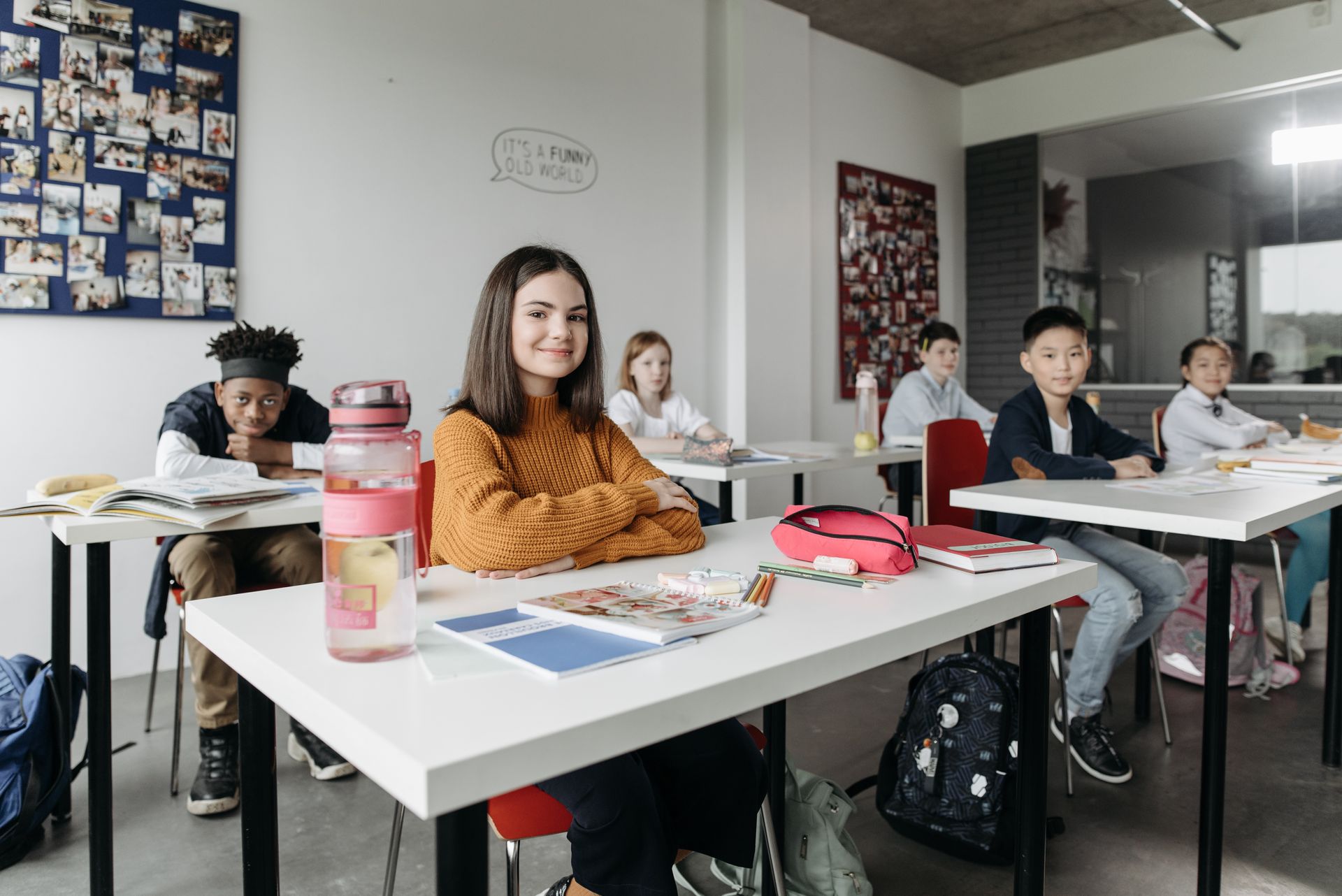 Students writing at their desks in an English classroom
