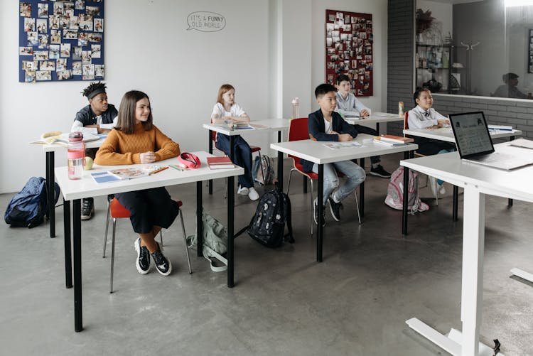 Students Sitting Behind Their Desk