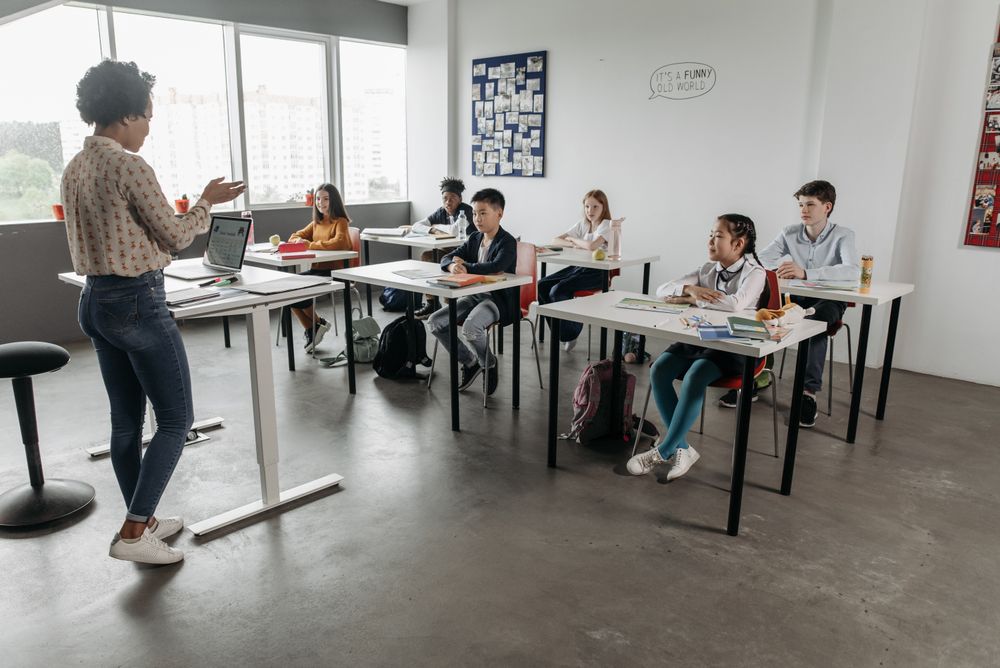 Teacher interacting with students in a classroom