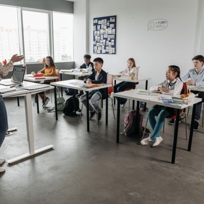 Teacher interacting with students in a classroom