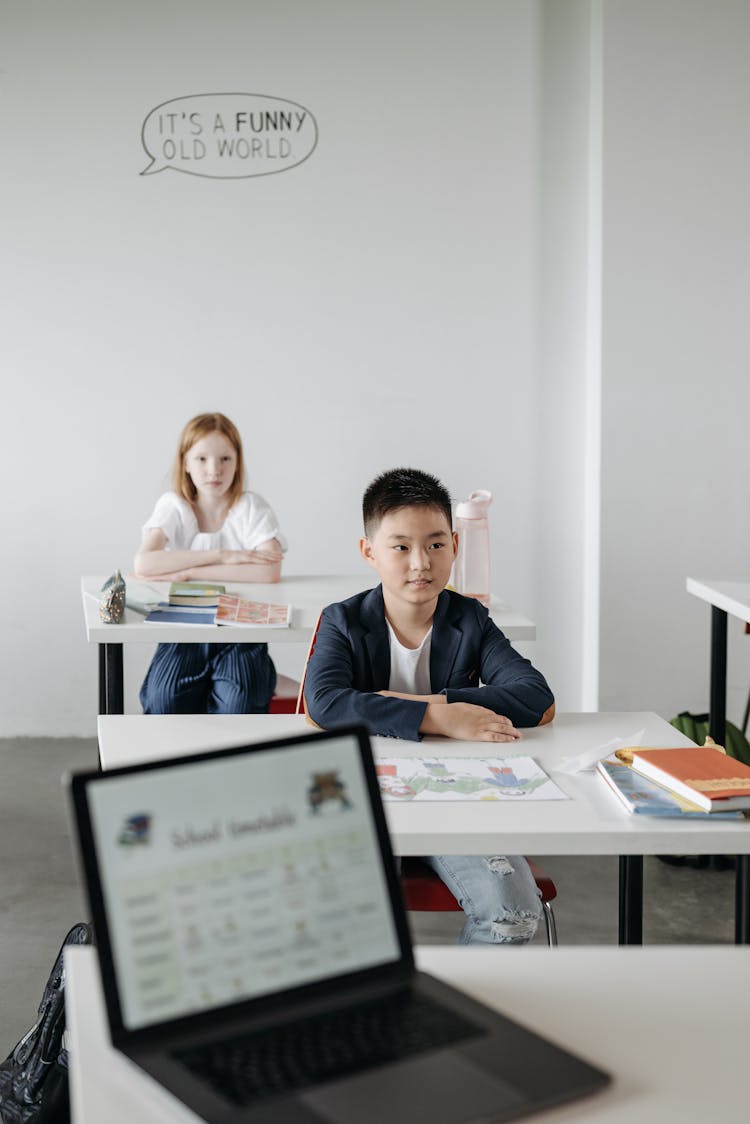 Kids Sitting At Their Desks