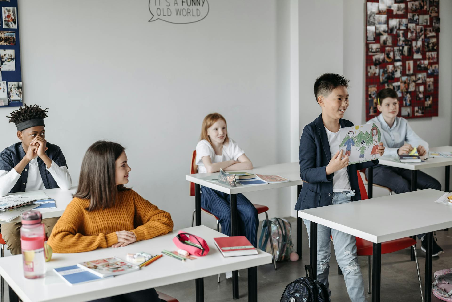 Students in a diverse classroom participating actively during a lesson, showcasing engagement and learning.