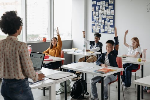 Free Children Sitting at the Table Stock Photo