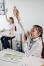 Girl in White Dress Shirt Sitting on Chair