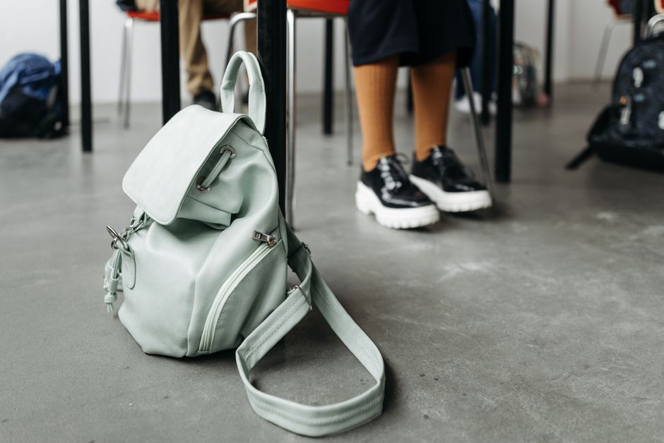 bag and notebook by the door everyday scene lifestyle photo 1