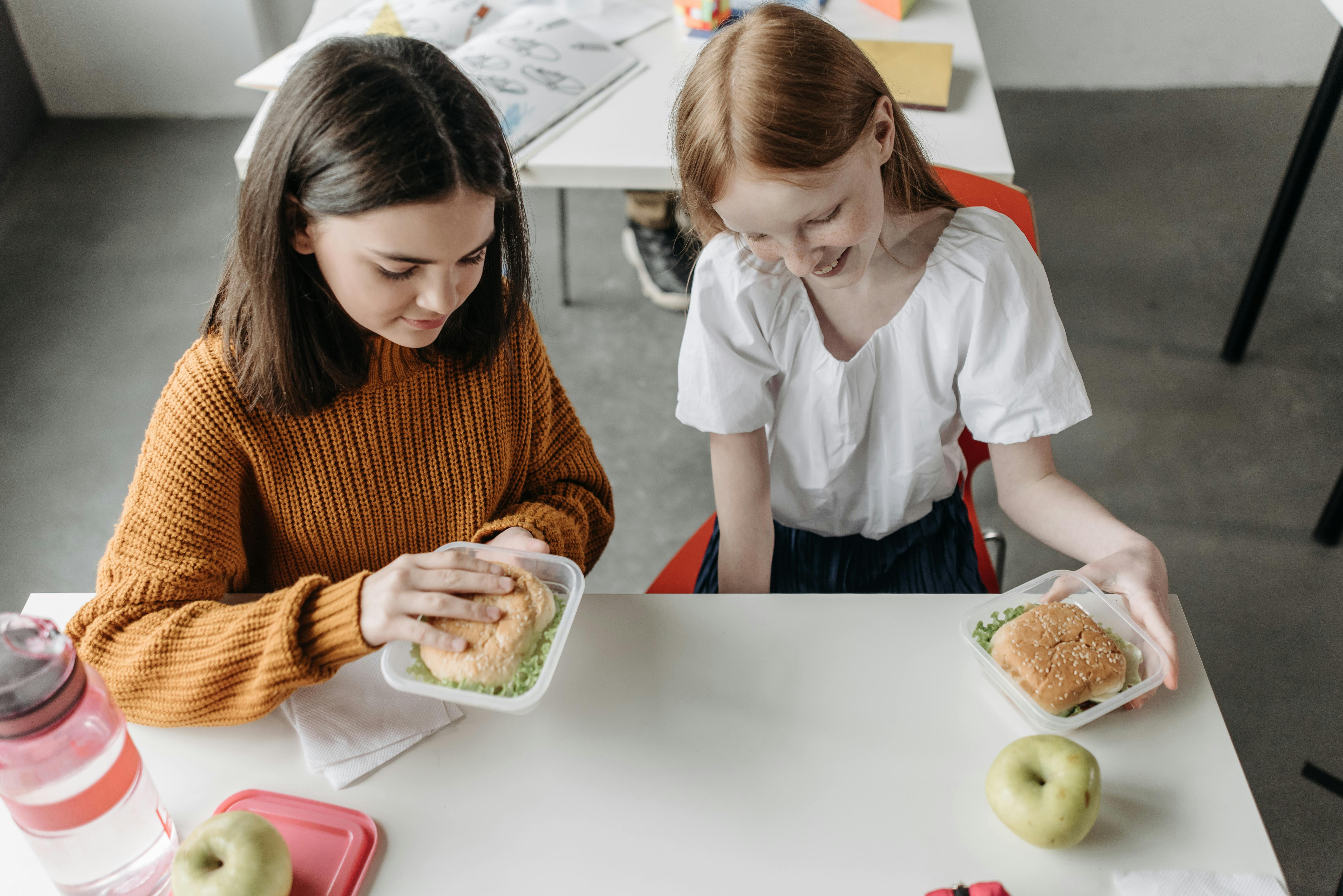 A Children Eating in the Canteen · Free Stock Photo