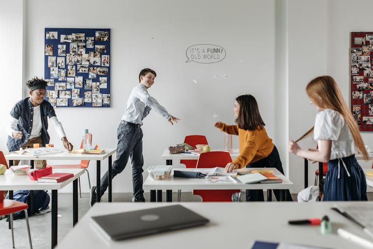 Young Students Playing Inside A Classroom