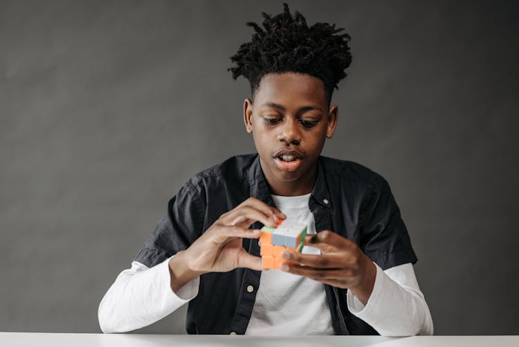 A Boy Holding Rubiks Cube