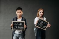 Kids Holding Small Blackboards