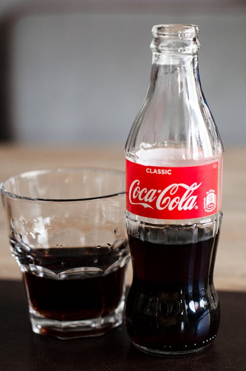 Coca Cola Bottle on Wooden Table top