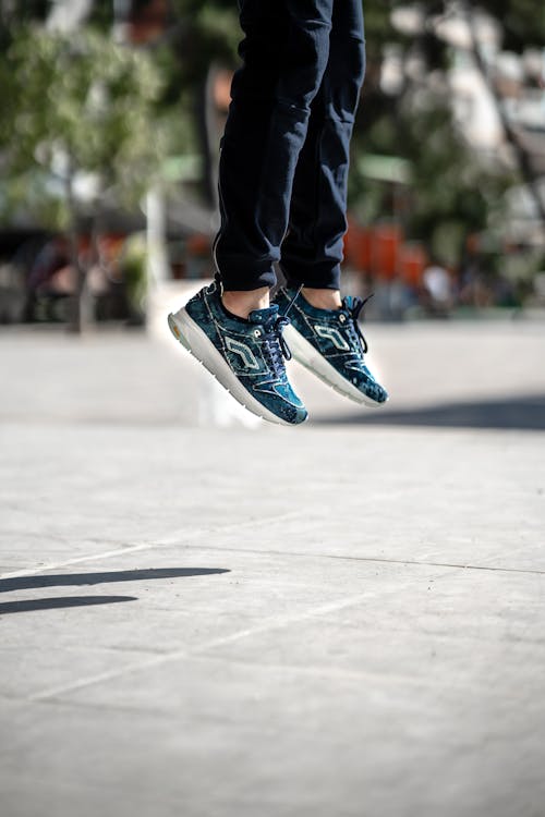 Close-Up Shot of Person Wearing a Blue Shoes