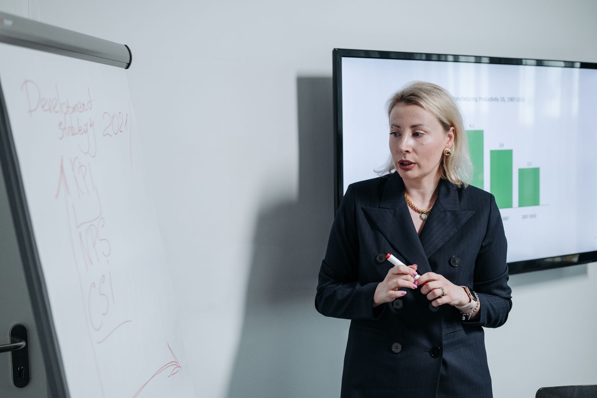Woman in Suit Discussing at Work