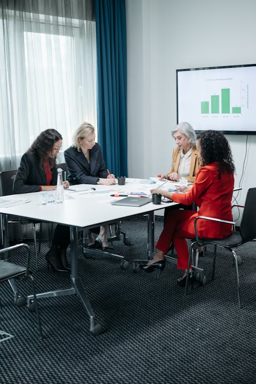 Free Business Women Having a Meeting Inside the Office Stock Photo