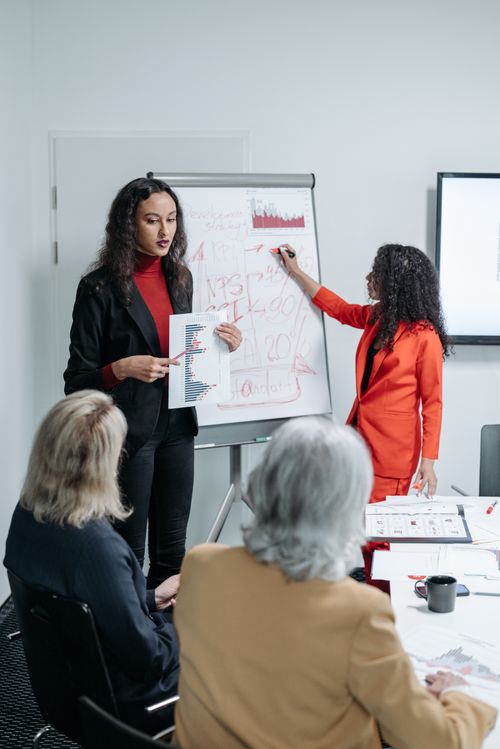 Free Dynamic business meeting highlighting teamwork and project proposals with colleagues. Stock Photo