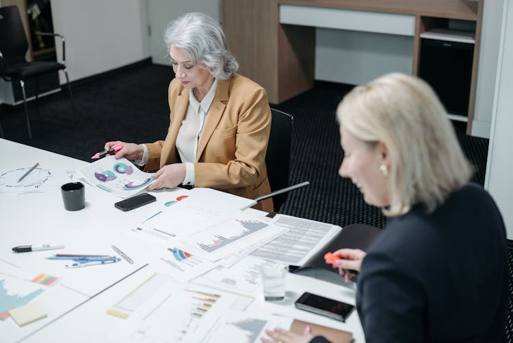 Women In Blazers In An Office