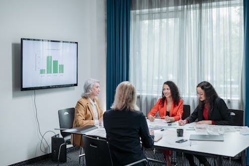 Free Business Women Having a Meeting Inside the Office Stock Photo