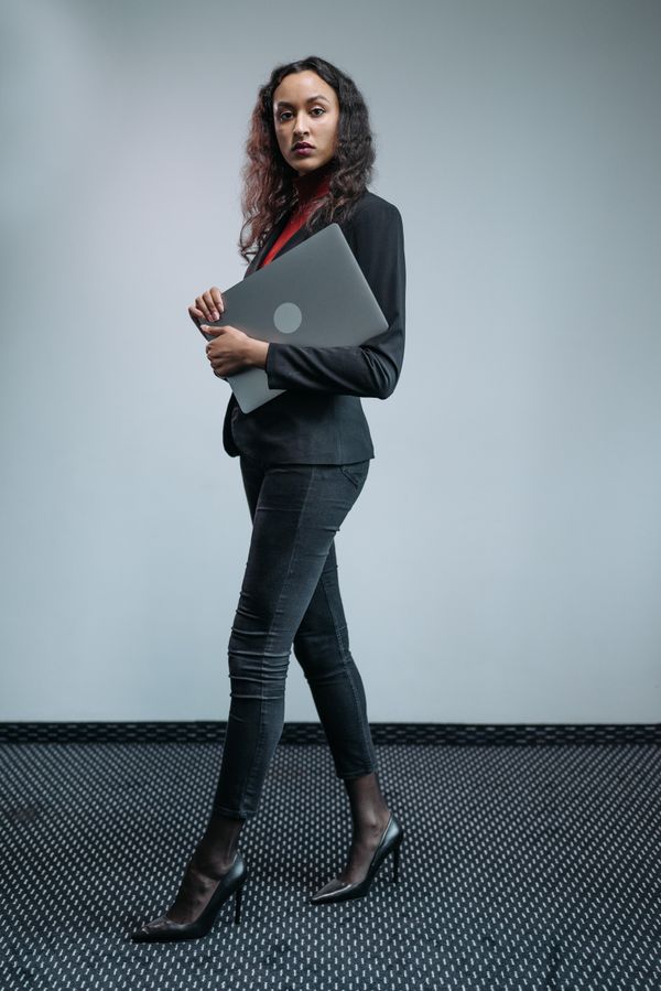Woman wearing a blazer dress with heels in the evening
