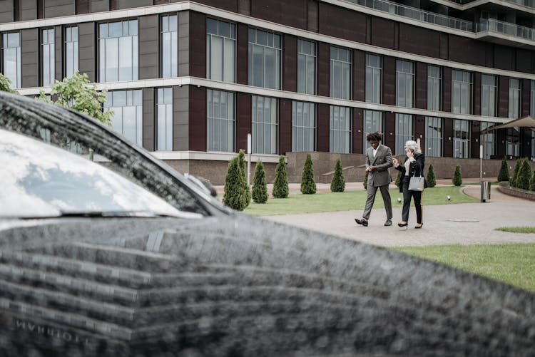 Coworkers Walking Together Outside Of A Building