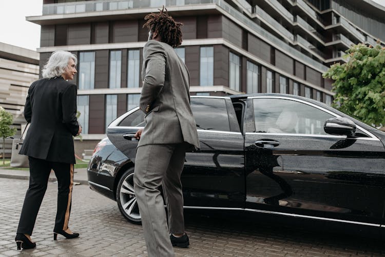 Man Opening A Car Door For A Woman